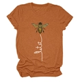 Close-up of a honey bee graphic and Let It Be cursive script on an orange cotton tee - S / Caramel Orange