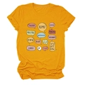 Detail of mustard yellow cotton T-shirt featuring multi-language teacher print graphics - S / Tops / Mustard Yellow