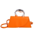 Chic orange leather trapezoid handbag with sculptural liquid metal handle and crossbody strap - Orange