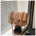 Detail of light brown quilted shoulder bag with silver floral rhinestone twist lock - Khaki
