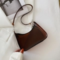 Translucent amber underarm bag with dark brown finish and silver metal hardware accents - Brown