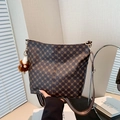 Retro monogram bucket bag in dark brown with colorful woven strap and plush charm - With Pendant / Brown