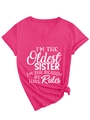 Hot pink V-neck t-shirt detail showing rolled sleeves and knotted hem with white text - Rose Red (White Font)