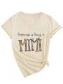 Detail of V-neck beige t-shirt with retro floral Mimi print and side knot hem - S / Sand (Black Graphic) (3812)