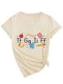 Dettaglio della stampa scolastica e del nodo decorativo su t-shirt beige con scollo a V - S / Sabbia