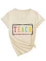 Detail of V-neck apricot T-shirt with Teach Them To Be Kind slogan and heart print - S / Sand (Black Graphic)