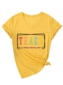 Detail of yellow V-neck T-shirt showing Teach Them To Be Kind print and knot hem - S / Yellow (Black Graphic)