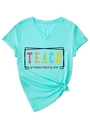 Close-up of V-neck T-shirt detail with Teach Them To Be Kind slogan and tied hem - S / Deep Water Blue (Black Graphic)