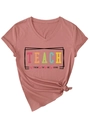 Detail of V-neck dusty rose T-shirt with Teach Them To Be Kind slogan and knotted hem - Rose Gold (Black Graphic)