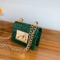 Forest green crocodile embossed mini chain bag with gold hardware on wooden surface - Green