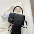Elegant black crocodile pattern handbag with gold hardware and wide decorative strap - Black