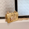 Mini gold chain crossbody bag with crocodile pattern and elegant metal lock closure - Gold