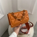 Orange quilted faux leather handbag with resin chain handle and wide woven strap - Brown