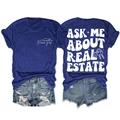 Vue à plat du t-shirt bleu marine Ask Me About Real Estate montrant l'avant et l'arrière - Bleu Rétro (Impression Blanche)