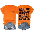 Détails avant et arrière d'un t-shirt orange Ask Me About Real Estate avec graphisme - Orange (Imprimé Noir)