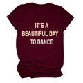 Detail of burgundy T-shirt with 'IT'S A BEAUTIFUL DAY TO DANCE' printed text on fabric - Burgundy