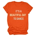 Detailed view of bright orange crewneck T-shirt featuring IT'S A BEAUTIFUL DAY print - Orange