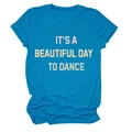 Close-up of blue cotton T-shirt featuring 'IT'S A BEAUTIFUL DAY TO DANCE' print detail - Lake Blue
