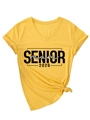 Close-up of mustard yellow V-neck T-shirt with Senior Mom 2026 print and side knot - S / Ginger (Black Print)