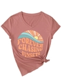 Macro shot of V-neck dusty rose t-shirt with rolled sleeves and a stylish front waist knot - Rose Gold