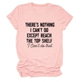 Flat lay of pink cotton T-shirt featuring a bold black artistic slogan on the front - Pink (Black Text)