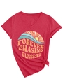 Detail of red V-neck T-shirt with Forever Chasing Sunsets graphic and front hem knot - Red