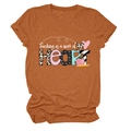 Detail of Teaching is a work of HEART print on a caramel short sleeve t-shirt - Burnt Orange (White Text)