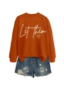 Detail of Let Them lettering and heart print on orange long sleeve sweatshirt - Burnt Orange (White Font)