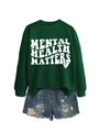 Detail of Mental Health Matters dark green sweatshirt with distressed denim shorts - Dark Green (White Font)