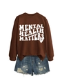 Detail of Mental Health Matters dark brown sweatshirt paired with distressed denim shorts - Coffee (White Font)