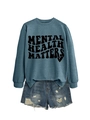 Detail of teal sweatshirt with Mental Health Matters print and frayed denim shorts - Blue (Black Font)