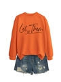 Detail of orange long sleeve sweatshirt with 'Let Them' print and distressed denim shorts - Orange (Black Print)