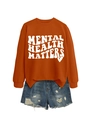 Flat lay of an orange Mental Health Matters sweatshirt with distressed denim shorts - Burnt Orange (White Font)