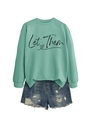 Close-up of mint green crew neck sweatshirt with black Let Them print and denim shorts - Light Green (Black Print)