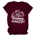Close-up of white graphic text on a burgundy cotton crew neck short sleeve T-shirt - Wine Red (White Font)