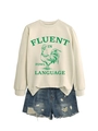 Détail du sweat blanc avec imprimé coq et short en jean bleu délavé à déchirures - Sable