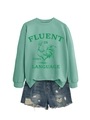Détail du sweat-shirt vert menthe avec imprimé coq et texte Fluent in Fowl Language - Vert clair