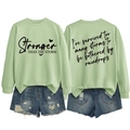 Detailed front and back view of green sweatshirt with Stronger Than The Storm print - S / Black Font / Olive Green