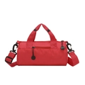 Red nylon cylindrical gym bag with adjustable shoulder strap and dual top handles - Red