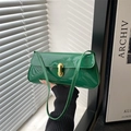 Glossy green patent leather baguette bag with gold buckle in minimalist armpit style - Green