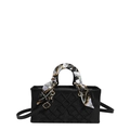 Elegant black quilted handbag with decorative silk scarf on handle and crossbody strap - Black