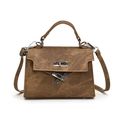 Brown vintage canvas handbag with silver twist lock and shoulder strap on white background - Brown