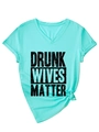 Close-up of mint green V-neck T-shirt with Drunk Wives Matter print and knotted hem - S / Deep Water Blue (Black Font)