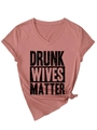 Detail of V-neck dusty rose t-shirt with Drunk Wives Matter graphic and knotted hem - Rose Gold (Black Font)