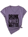 Detail of purple V-neck tee with Drunk Wives Matter print and knotted hem detail - Purple (Black Text)
