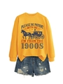 Detail of yellow sweatshirt with vintage text print and distressed denim shorts - Yellow