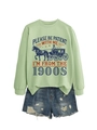 Flat lay of a mint green sweatshirt with 1900s slogan and distressed denim shorts - Olive Green