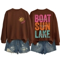 Flat lay view of brown sweatshirt back with colorful Boat Waves Sun Rays text print - Coffee-White Text Print