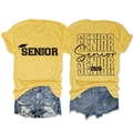Flat lay of Senior 2026 t-shirt and ripped denim shorts showing front and back design - Yellow (Black Font)
