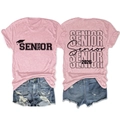 Detailed front and back views of Pink Senior 2026 Graduation T-shirt with denim shorts - Pink (Black Font)